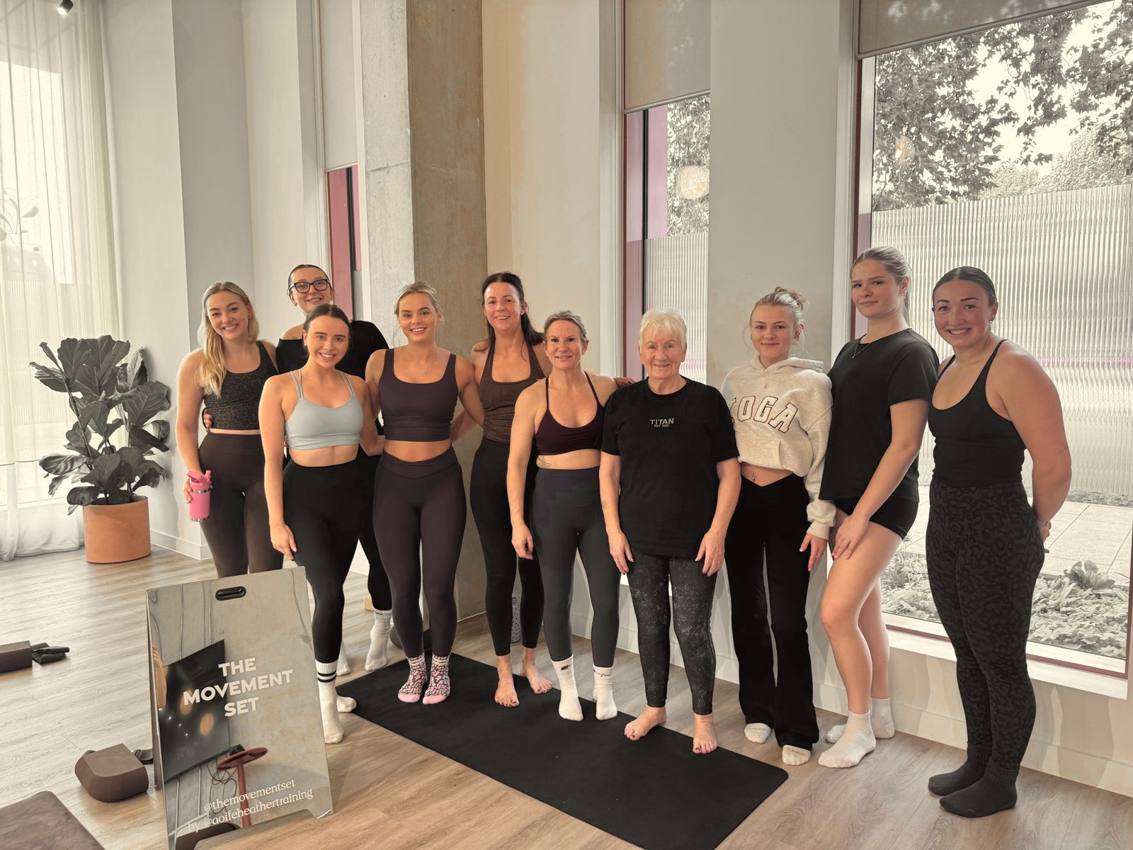 The Set 01 group standing together after class beside The Movement Set mirror